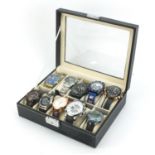 Ten gentlemen's wrist watches housed in a display case, including Megalith, Casio and Timex :For