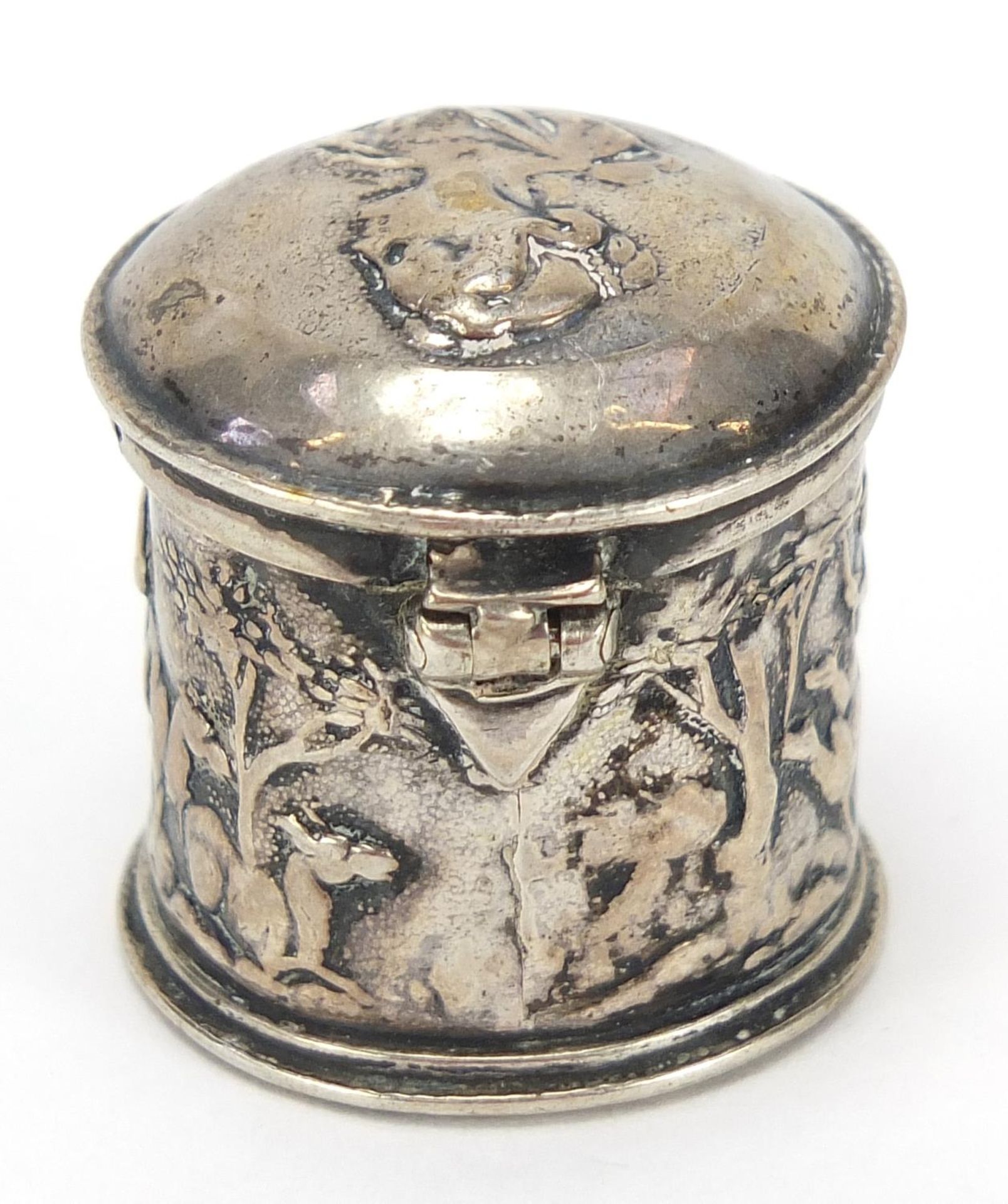 Antique silver cylindrical box with hinged lid embossed with mythical figures, indistinct marks to - Image 2 of 4