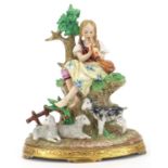 German porcelain figurine of a female playing a flute with a kid and two lambs, 19.5cm high :For