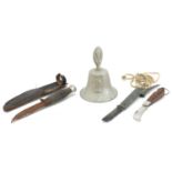 Militaria comprising a bell made from a German aircraft, folding pocket knife and a combat knife,