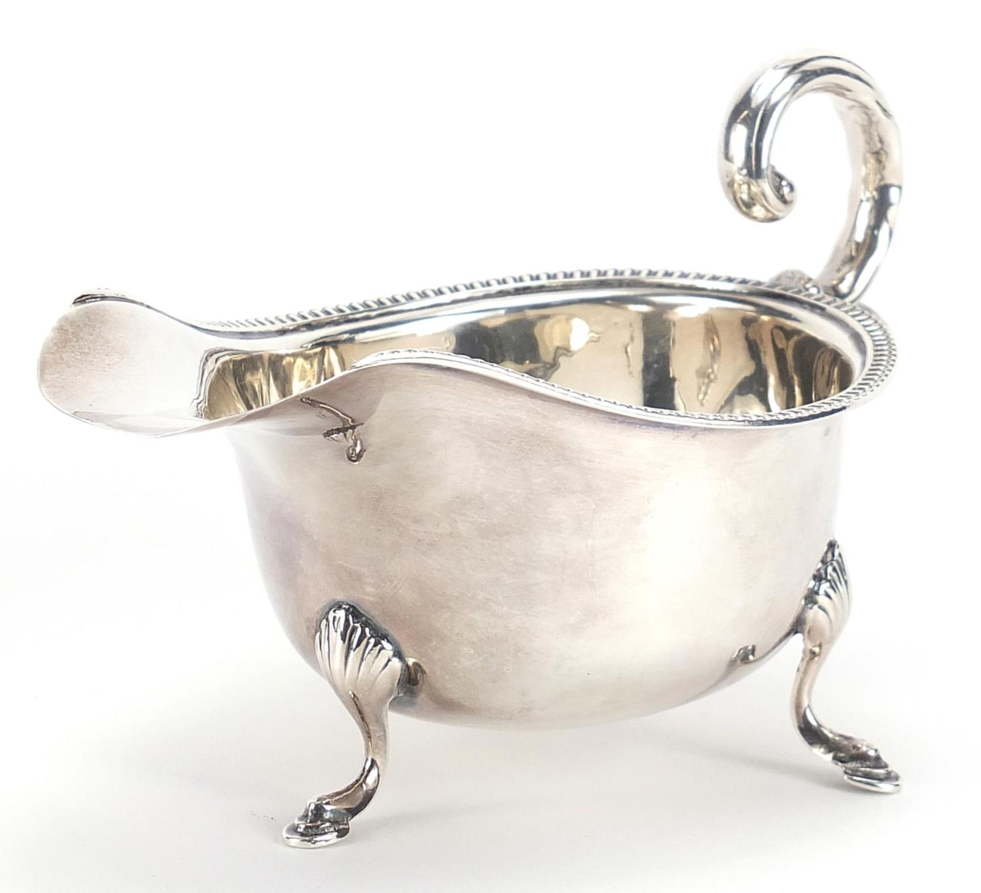 Silver sauce boat raised on three hoof feet, Birmingham, 1932, 15cm in length, 99.2g :For Further