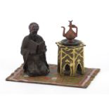 Cold painted bronze of a figure on a carpet in the style of Franz Xaver Bergmann, 14.5cm wide :For