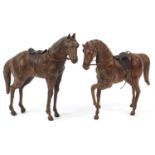 Two leather covered horses, the largest 33cm in length :For Further Condition Reports Please Visit