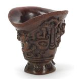 Chinese libation cup carved with dogs of Foo, four figure character marks to the base, 13.5cm