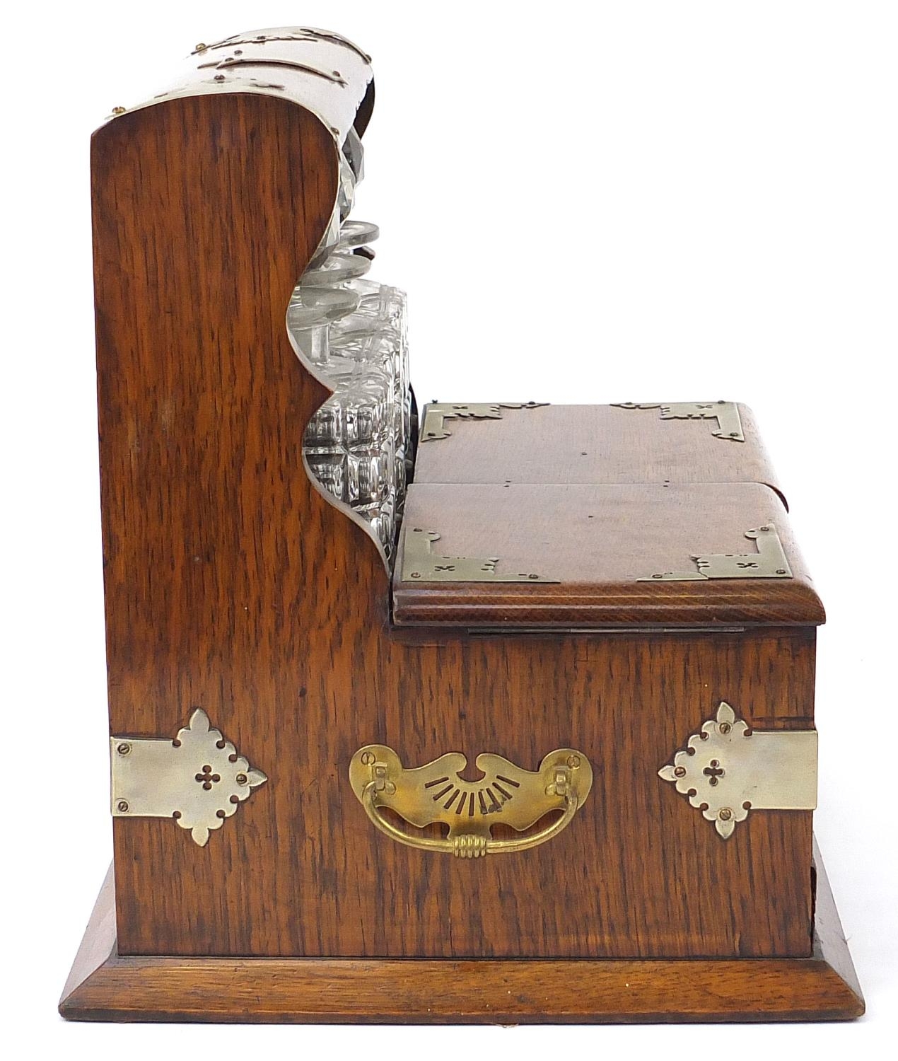 Victorian oak tantalus compendium with metal mounts and carrying handles fitted with three glass - Image 5 of 7