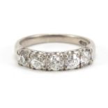 14ct white gold diamond five stone ring, the central diamond approximately 3.8mm in diameter, size