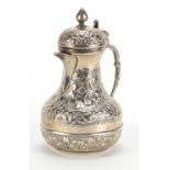 Egyptian silver coffee pot embossed with flowers and foliage, impressed marks to the base, 15cm