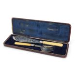 Set of Victorian silver plated fish servers with ivory handles housed in a fitted case, the case