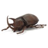 Large Japanese patinated bronze beetle with articulated back, indistinct impressed marks to the