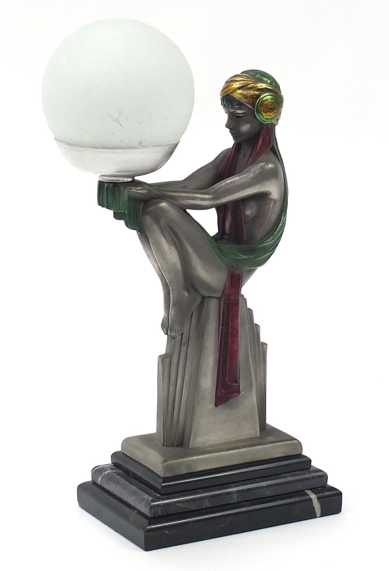 Art Deco design desk lamp in the form of a scantily dressed female with globular glass shade, raised