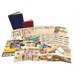 Antique and later ephemera including stamps arranged in albums and cigarette cards :For Further