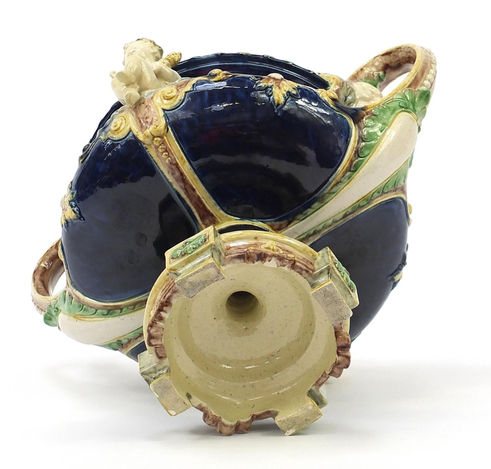 19th century Majolica centrepiece with twin handles surmounted with two Putti, 27.5cm high x 33. - Bild 5 aus 6