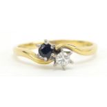 18ct gold diamond and sapphire crossover ring, the diamond approximately 3.5mm in diameter, size