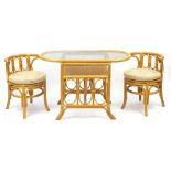 Oval bamboo table with two chairs and glass top, the table 73cm H x 110cm W x 57cm D, each chair