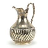 Continental 900 grade silver jug with demi fluted body, impressed marks to the base, 16cm high,