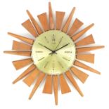 Mid century design teak sunburst design wall clock by Anstey Wilson, 51cm in diameter :For Further