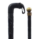 Two Indian ebony walking sticks including one with carved elephant head handle, the largest 87cm