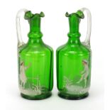 Pair of Victorian Mary Gregory green glass claret jugs, each 24cm high :For Further Condition