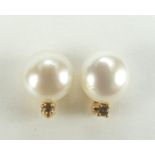 Pair of 9ct gold freshwater pearl and diamond stud earrings, 8mm high, 1.0g :For Further Condition