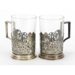 Pair of silver niello work cup holders, impressed Russian marks to the base, 9.5cm high excluding
