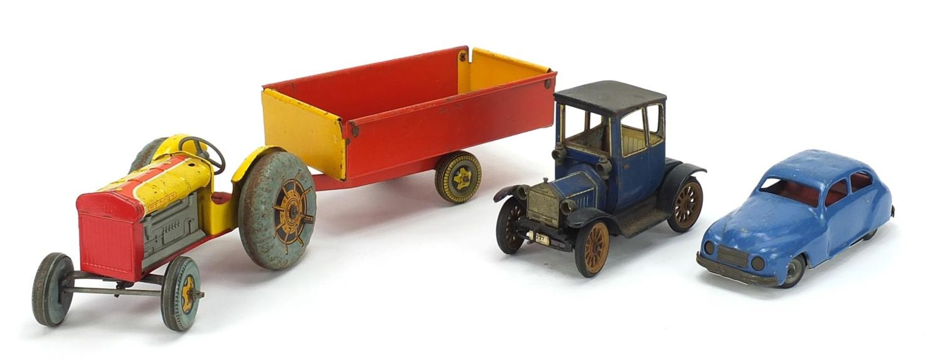 Antique and later tinplate toys comprising a Schuco Ford Coupet 1917, Chad Valley Harborme car and a