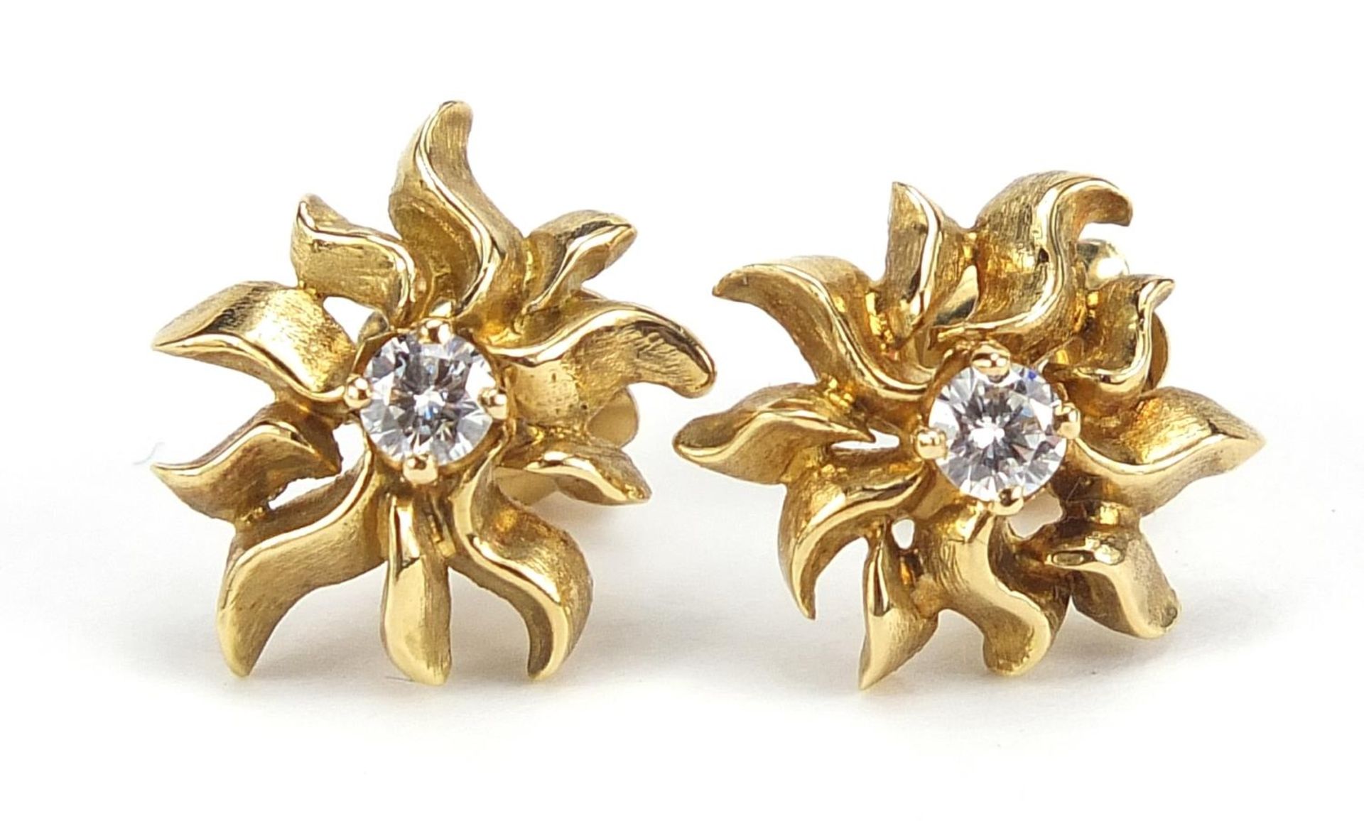 John Donald, pair of Modernist 18ct gold diamond solitaire stud earrings housed in a John Donald