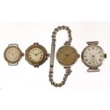 Four silver ladies and gentlemen's wristwatches including a military interest trench watch, the
