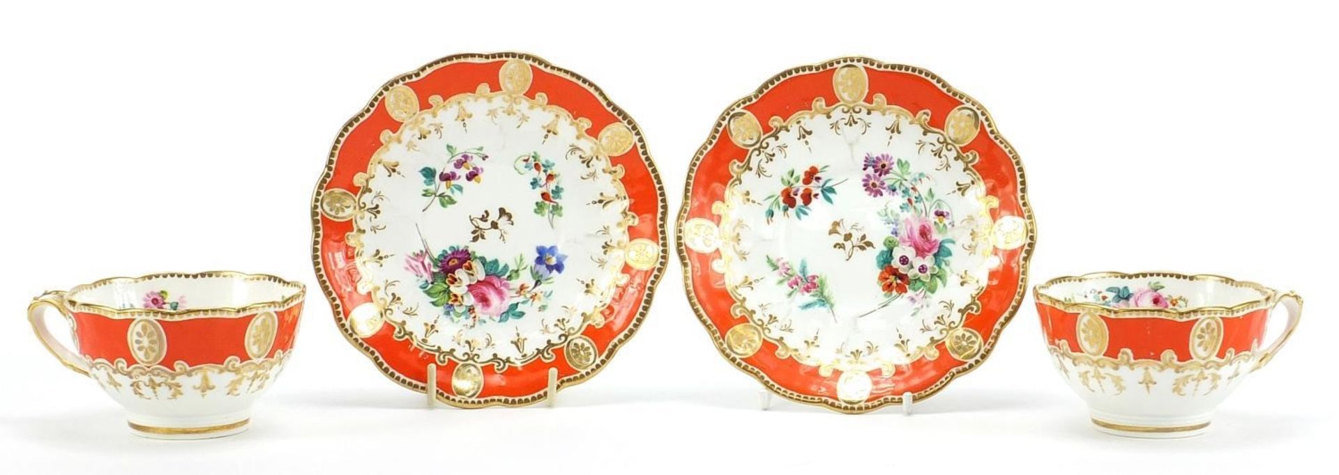 Pair of 19th century porcelain cups and saucers finely hand painted with flowers, numbered 1743,
