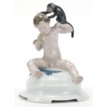 Ferdinand Liebermann for Rosenthal, porcelain figure of a young boy feeding a monkey, 17cm high :For