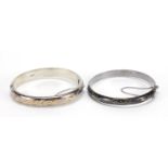 Two silver hinged bangles including one with Niello work, total 30.2g :For Further Condition Reports