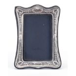Douglas Pell Silverware, rectangular silver easel photo frame embossed with swags, London 1985, 18cm