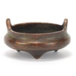 Chinese patinated bronze tripod censer with twin handles, character marks to the base, 5.5cm in