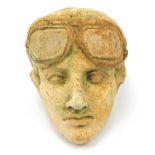 Military interest garden stoneware wall mask of a pilot, 26cm high :For Further Condition Reports