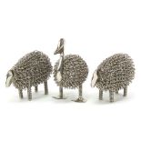 Three white metal animals comprising two sheep and a duck the largest 14cm high :For Further