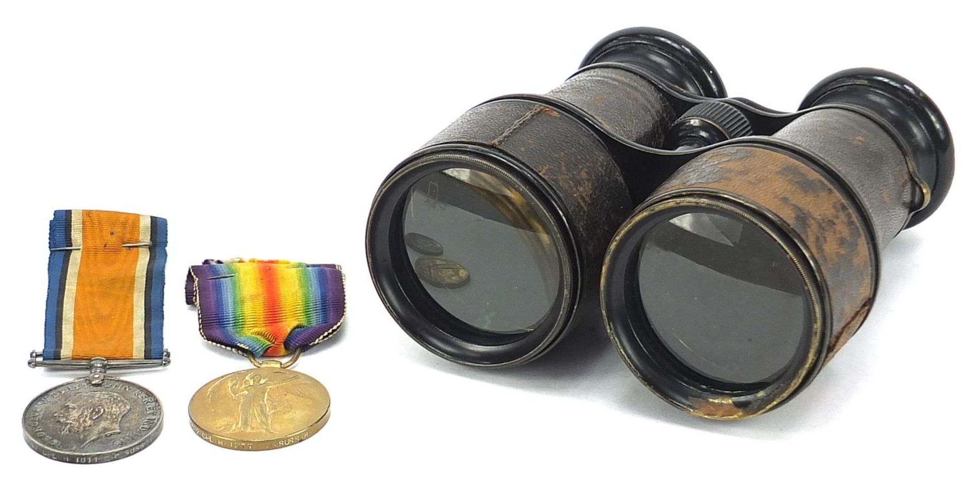 British military World War I pair and leather bound binoculars, the pair awarded to 1482CPL.H.TUTT.