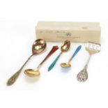 Scandinavian silver cutlery comprising three gilt and enamel spoons by David Andersen, USF fish