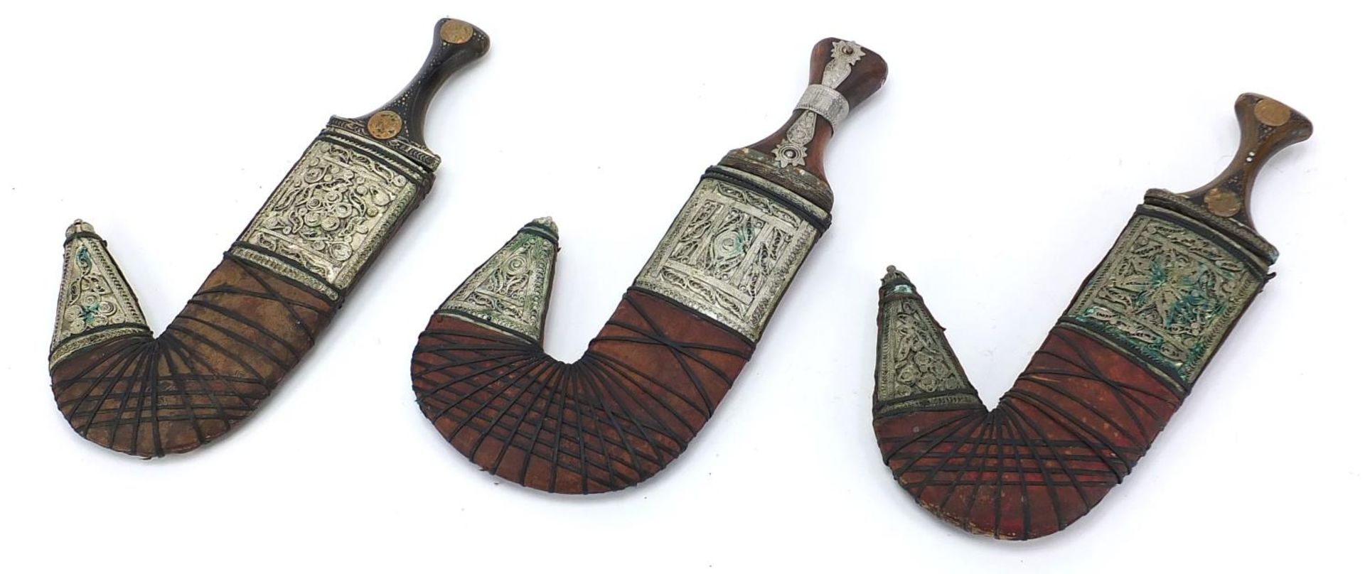 Three Islamic jambiya daggers with horn handles, leather sheaths and white metal mounts, each - Image 5 of 5