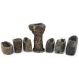 Seven Islamic carved stone oil lamsp including four in the form of birds, 14cm high :For Further