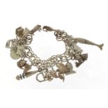 Silver charm bracelet with large selection of mostly silver charms including bust of William