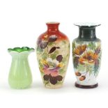 Two Victorian hand painted opaline glass vases and one other, the largest 26.5cm high :For Further