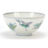 Chinese porcelain doucai footed bowl hand painted with cranes and peach trees, six figure