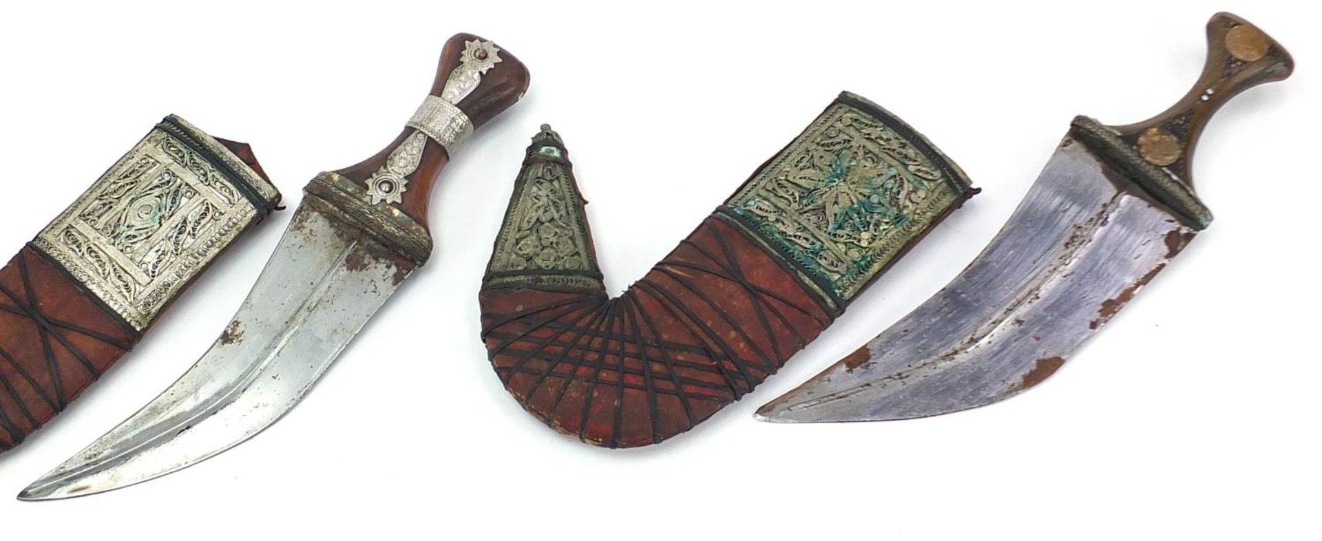 Three Islamic jambiya daggers with horn handles, leather sheaths and white metal mounts, each - Image 3 of 5