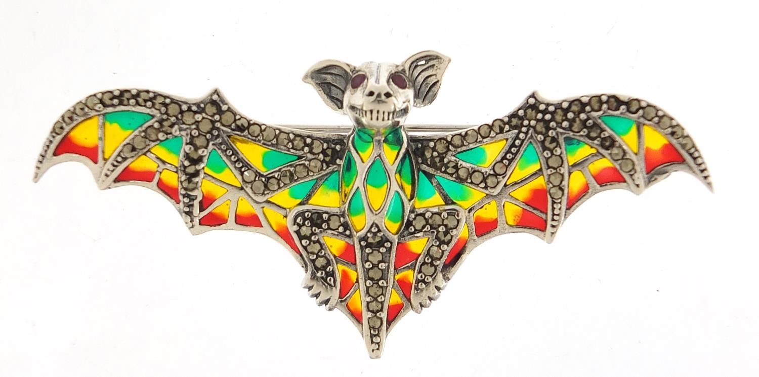 Silver, marcasite and plique à jour enamel bat brooch with ruby eyes, 8cm wide, 12.5g :For Further