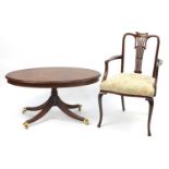 Oval inlaid mahogany coffee table with brass paw feet and a Gainsborough style chair, 49cm H x