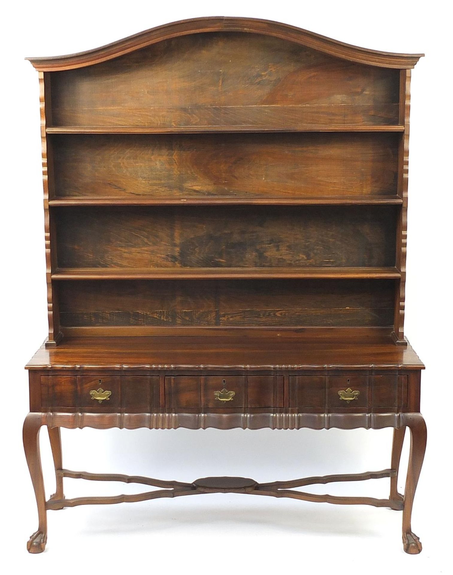 Jonker of Knysna, South African stinkwood dresser with open plate rack above three drawers, on