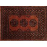 Rectangular Persian orange ground rug having all over geometric design, 148cm x 107cm :For Further