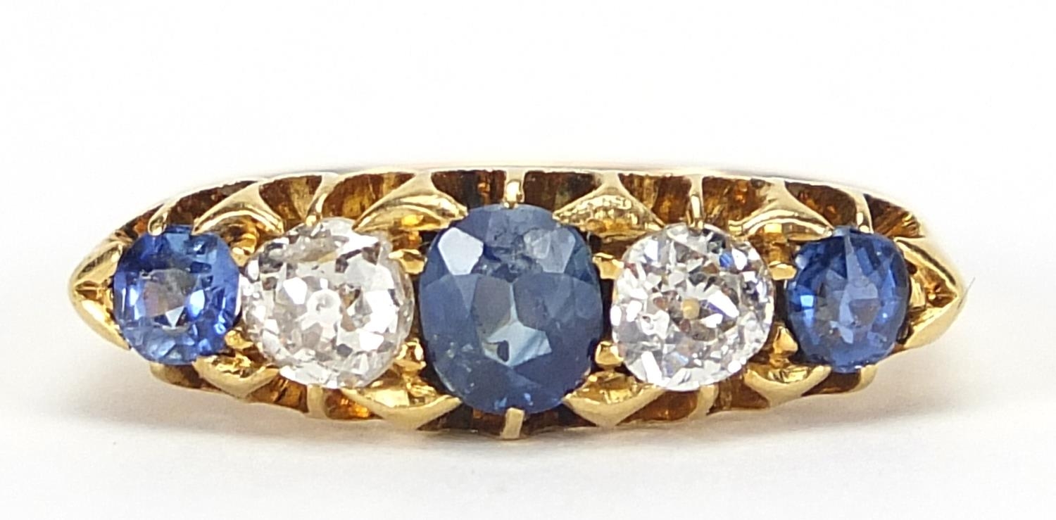 Victorian 18ct gold sapphire and diamond five stone ring, the central sapphire approximately 4.8mm x