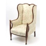 Arts & Crafts wing back armchair with floral upholstery, 104.5cm high :For Further Condition Reports