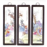 Three Chinese porcelain panels depicting figures and calligraphy, each housed in hardwood frames,