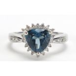 9ct white gold diamond and blue stone ring, (tests as a sapphire) size N, 3.2g :For Further